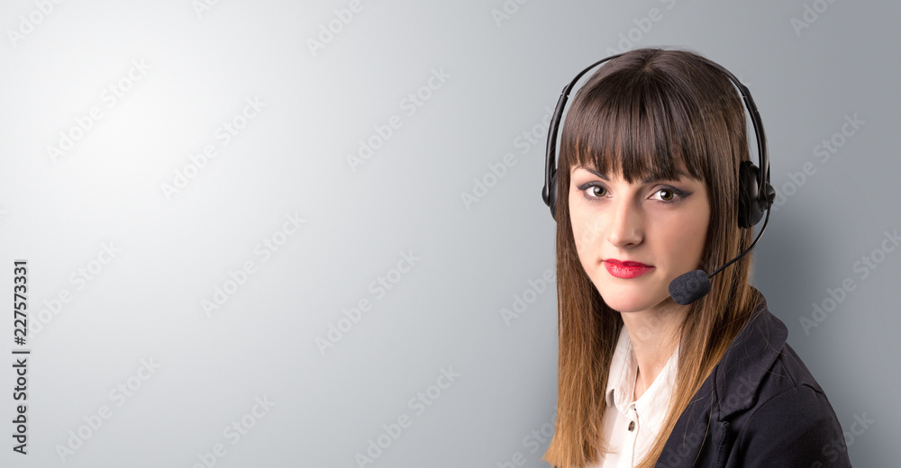 Young female telemarketer on a white background Young female telemarketer on a white background