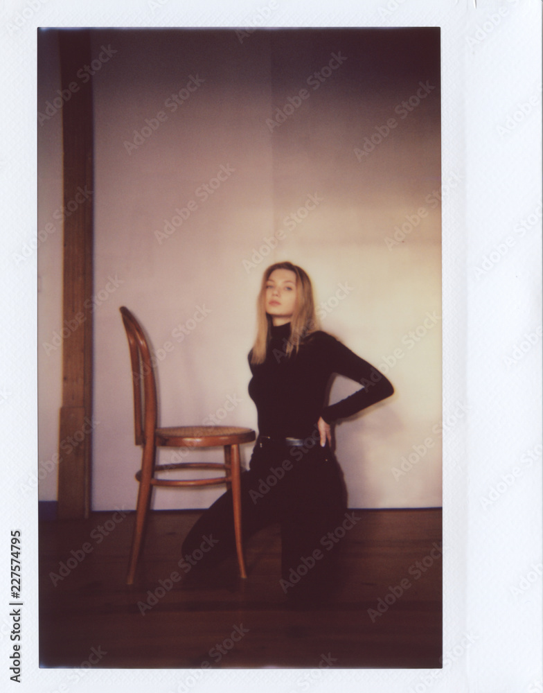 Sensual model in black posing on floor