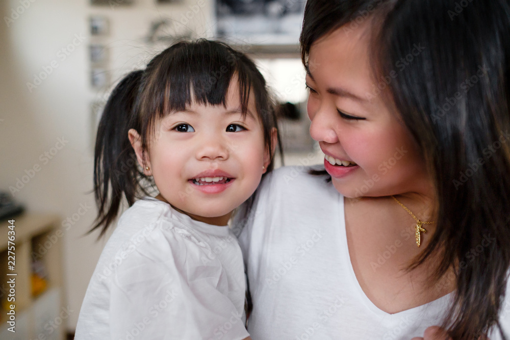 Asian Mother and Daughter Spending Time Together at Home Asian Mother and Daughter Spending Time Together at Home