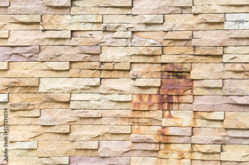 Rust - burned yellow stone wall background