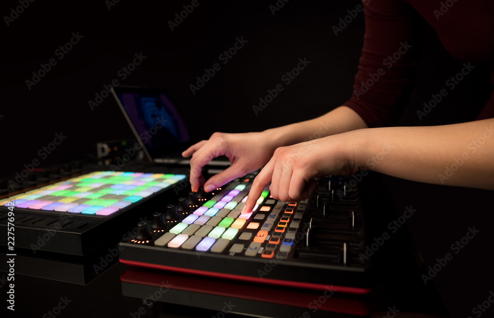 Fototapeta premium Dj hand remixing music on midi controller 