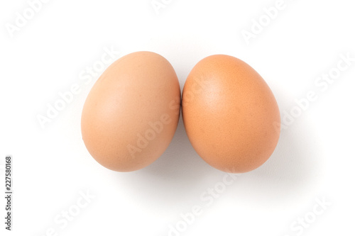 Couple brown chicken egg on white background