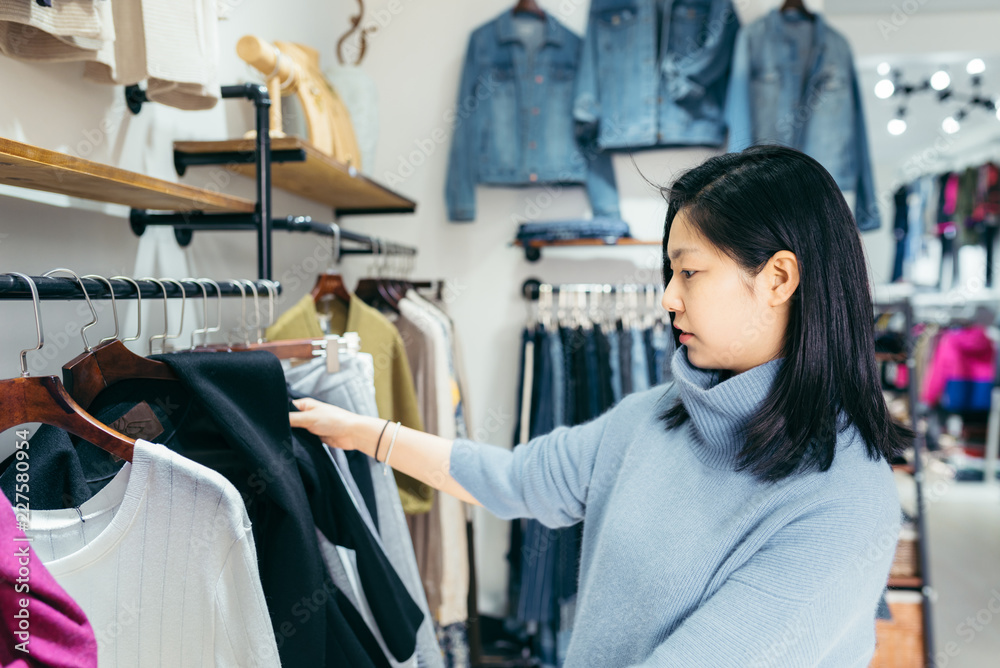Fashion lady buying in clothing store Fashion lady buying in clothing store