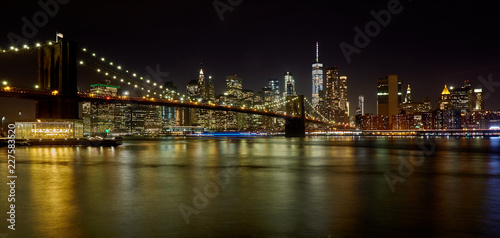 beautiful night skyline of downtown New York with Brooklyn bridge in the foreground