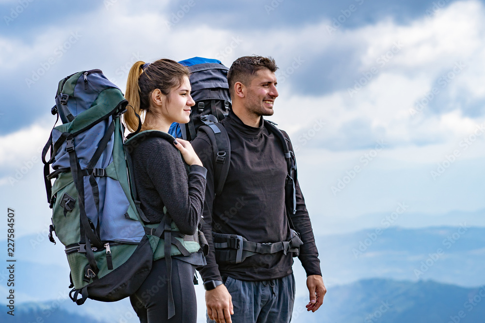 Fototapeta premium The happy couple standing on the mountain