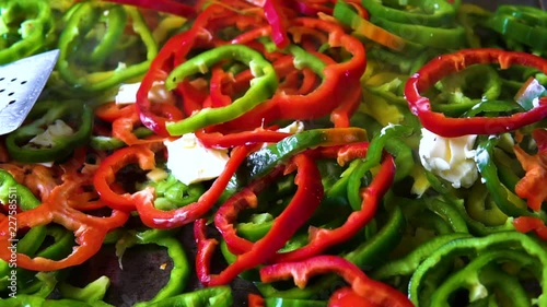 Saut√© Sliced Red and Green Bell Peppers on a Commercial Griddle, Sizzle and Steam, Close Up Shot photo