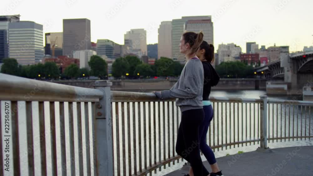 Fit Young Women, Stop At Railing And Stretch, Enjoy City Views At Sun Down, Slow Motion