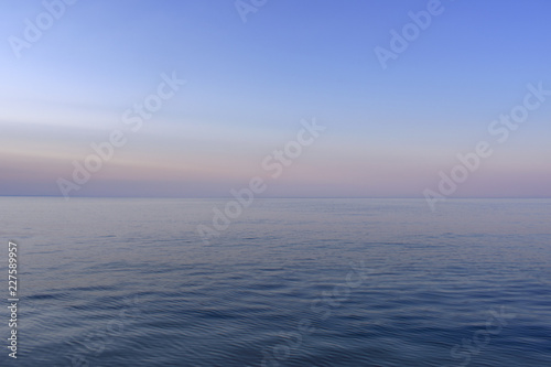 The calm sea with the purple colors of the sky © Dimitrios