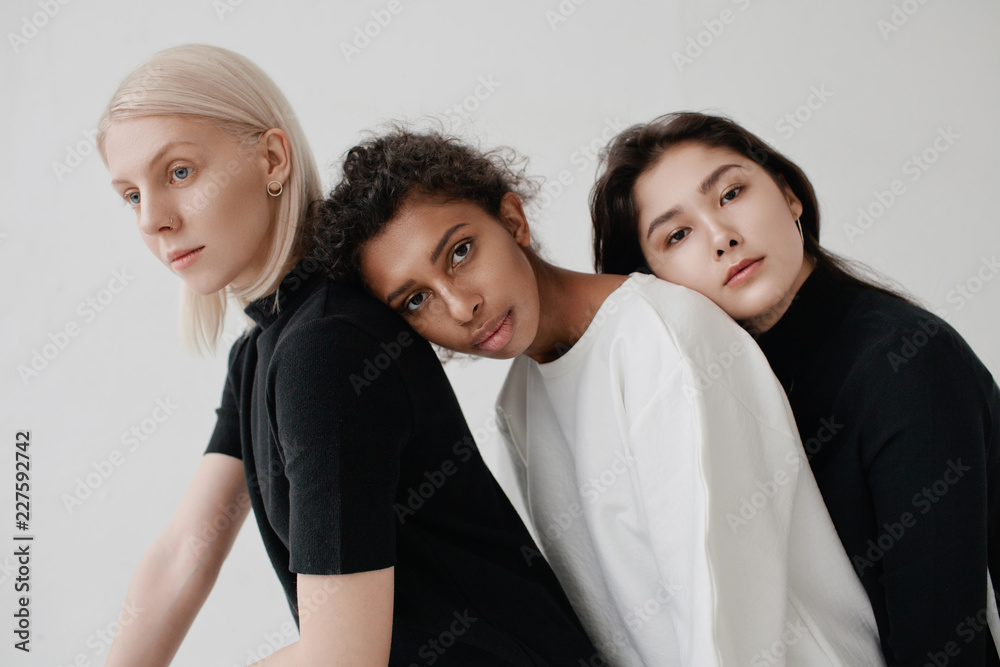 Studio portrait of three multiethnic women Studio portrait of three multiethnic women