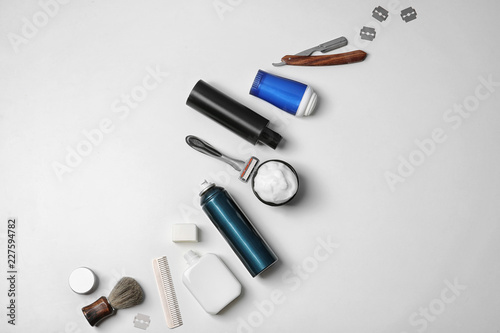 Flat lay composition with shaving accessories for men on white background