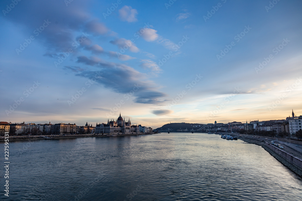 view of parliament and danube at sunset in budapest