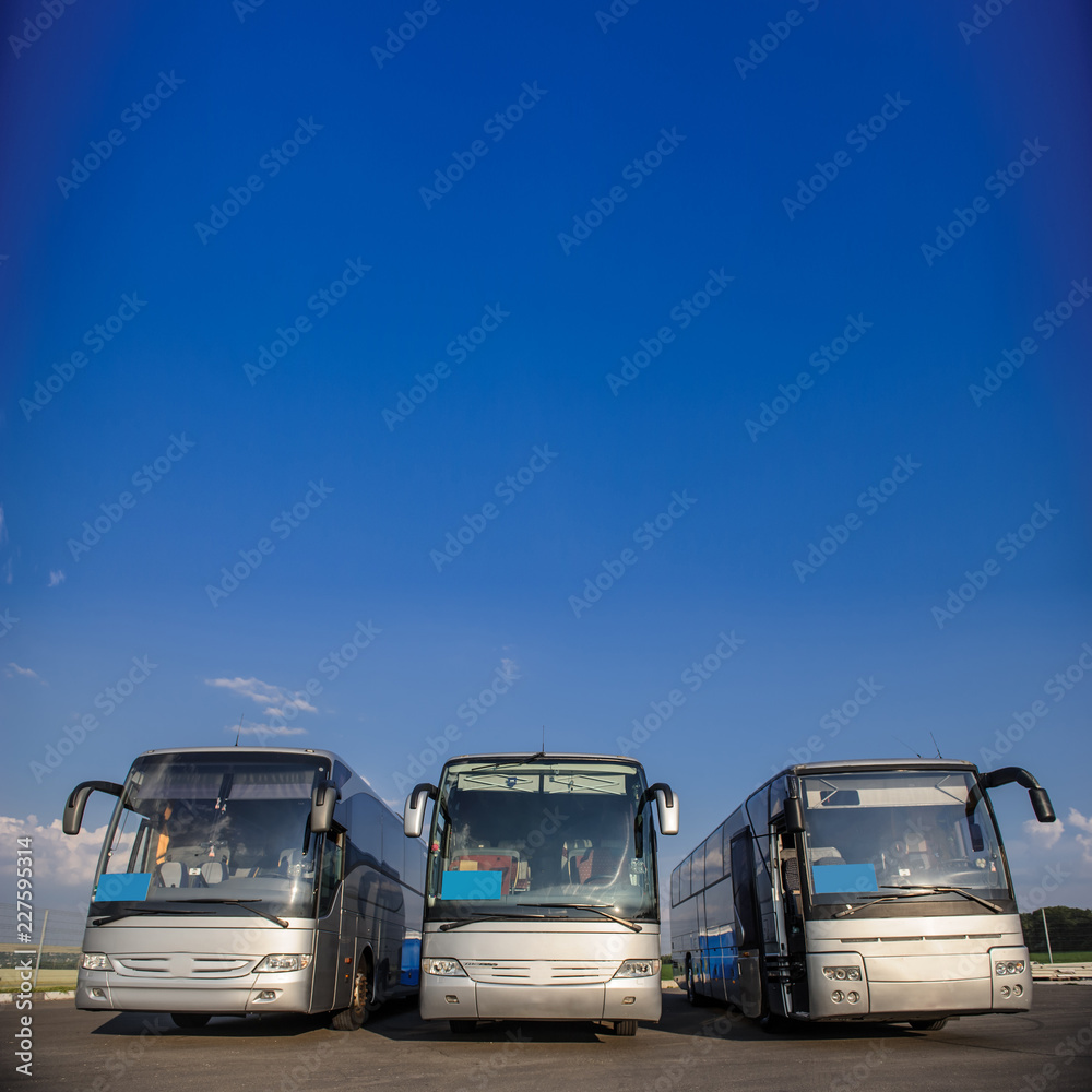 Three buses staying in the parking lot Front Way