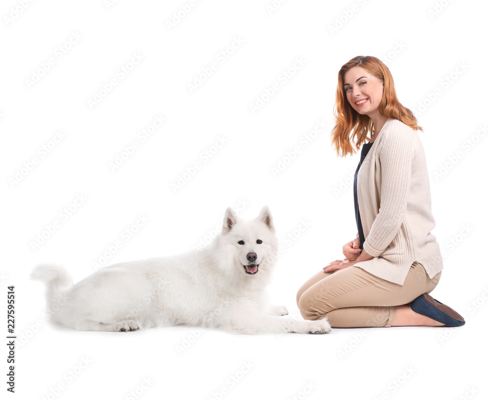 Beautiful woman with her cute dog on white background Beautiful woman with her cute dog on white background
