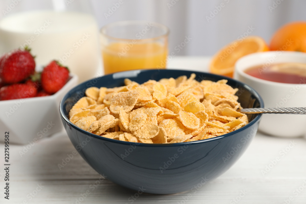 Bowl with healthy cornflakes for breakfast served on table, closeup Bowl with healthy cornflakes for breakfast served on table, closeup
