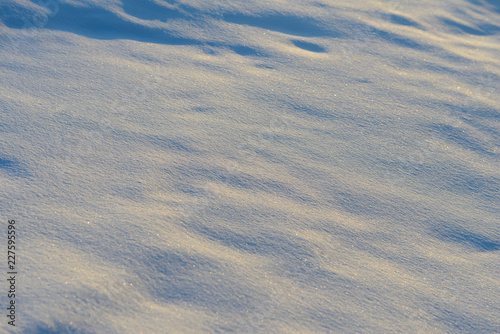surface of snowdrifts in winter sunny day