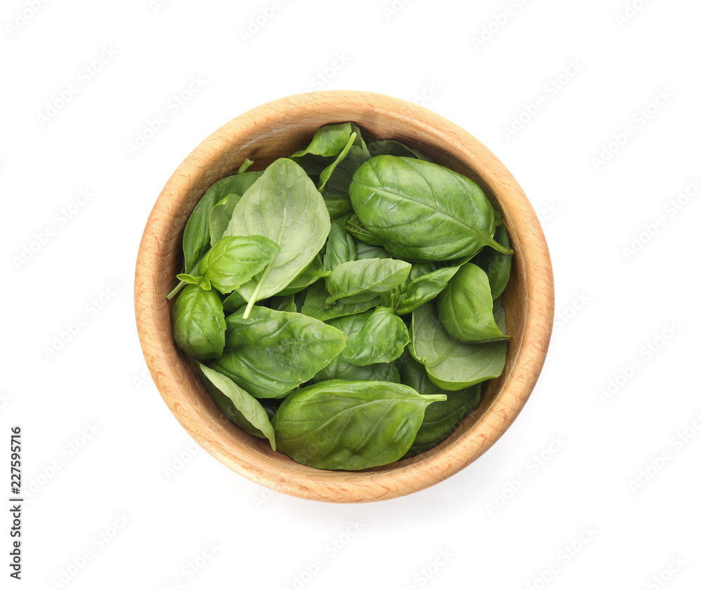 Bowl of fresh green basil leaves on white background, top view Bowl of fresh green basil leaves on white background, top view