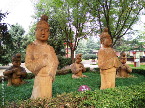 Stone statues of ancient chinese men and women in Qujiang New District, Xian city, Shaanxi province, China photo