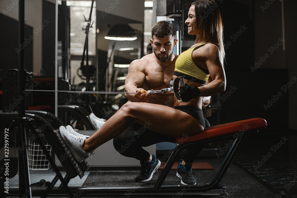 Model young man and woman working out in gym