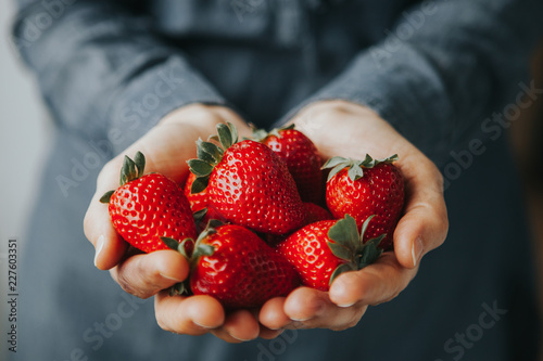 Hands Holding Strawberries photo