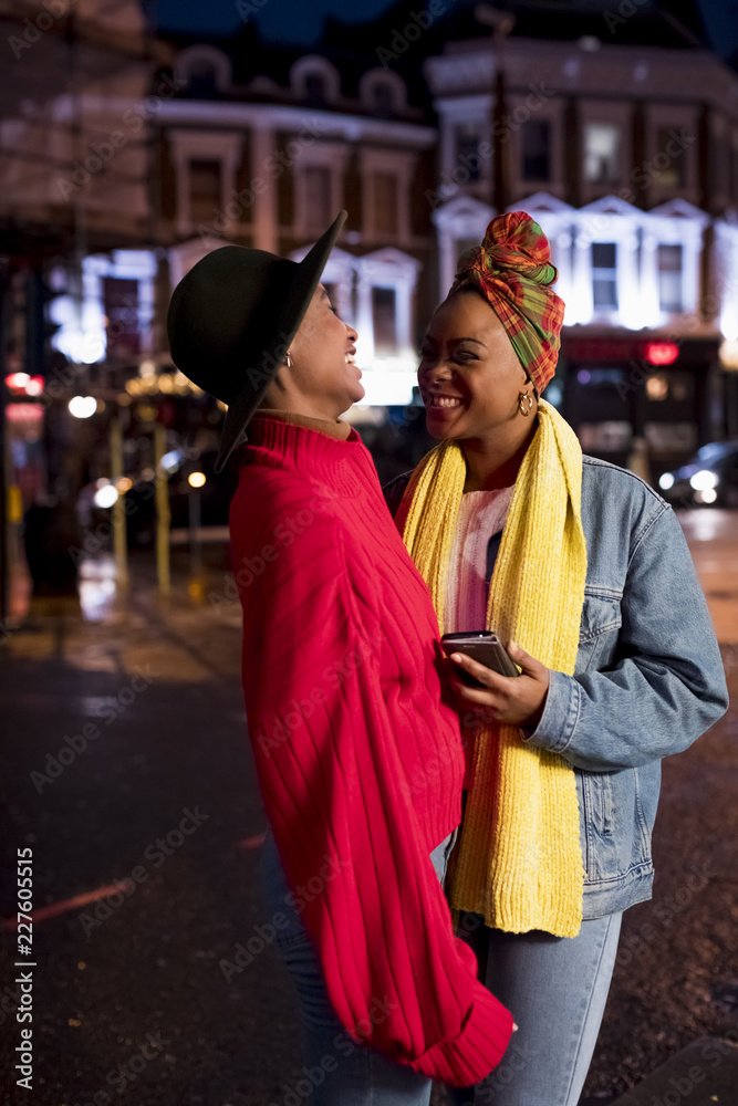 Stylish women during nightlife in the city Stylish women during nightlife in the city