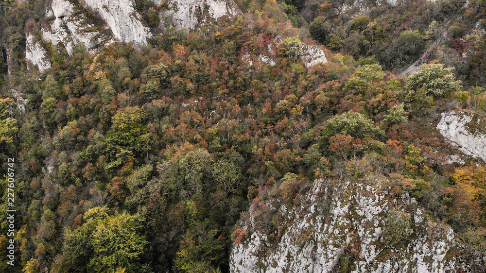 view of mountains in national park Cheile Nerei Beusnita in Romania. Part of Carpathian mountains with beautiful autumn colors.