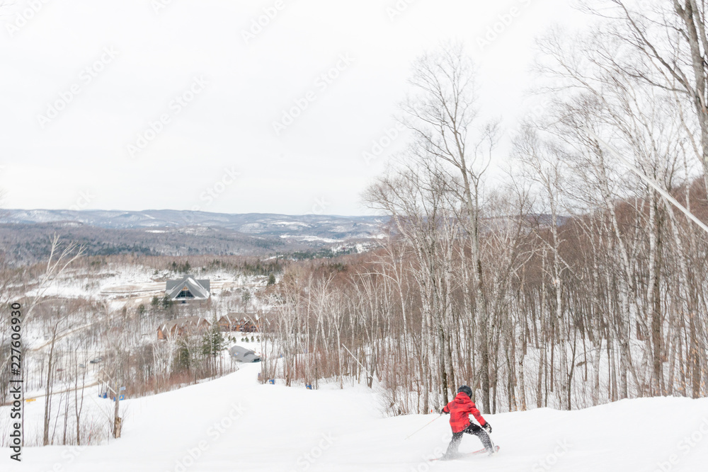 Child sprays powdery snow as he skis down a mountain Child sprays powdery snow as he skis down a mountain