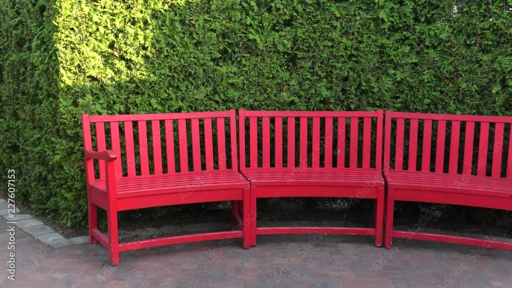 Red bench standing in a park. 4K, UHD, 50p, Cinematic, Red bench standing in a park. 4K, UHD, 50p, Cinematic,