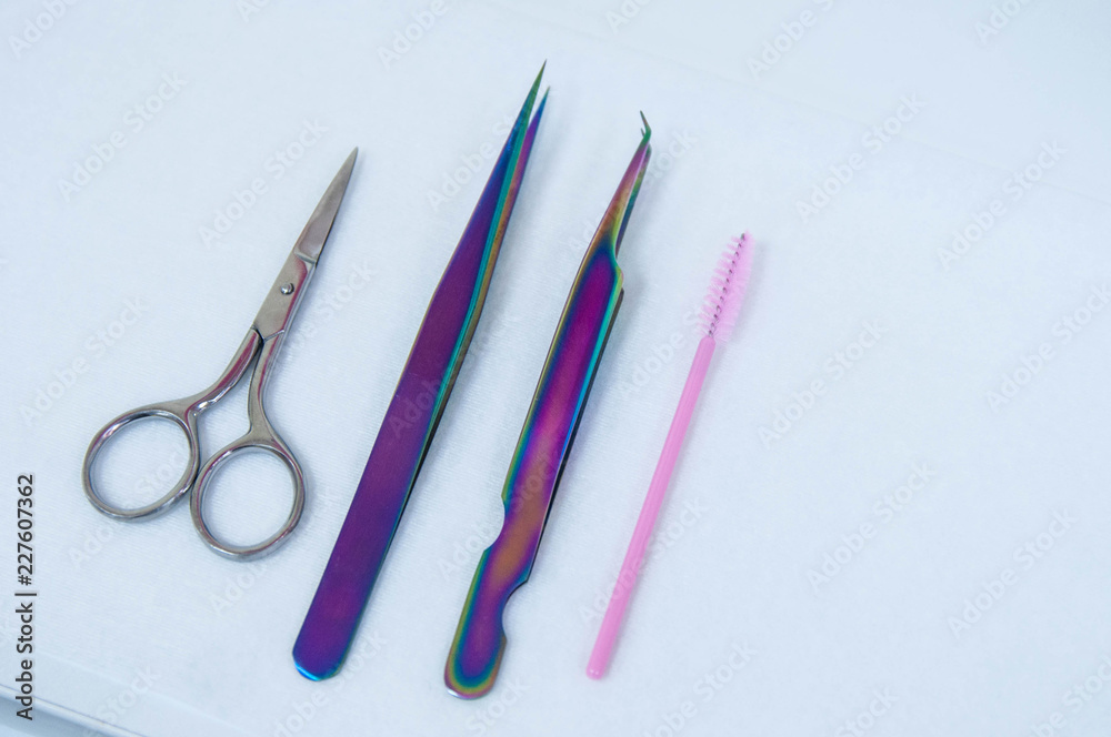Instruments: Beauty and fashion concept - Eyelash Extension Procedure. Tools for eyelash extension. False eye lashes, glue, tweezers Instruments: Beauty and fashion concept - Eyelash Extension Procedure. Tools for eyelash extension. False eye lashes, glue, tweezers