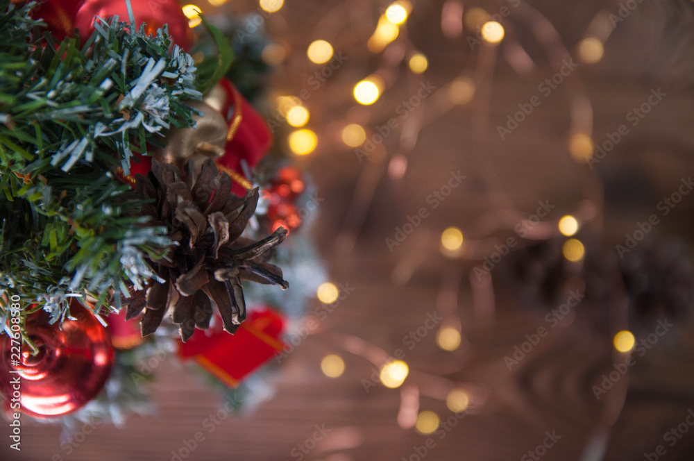 Happy new year and Merry Christmas concept. Christmas tree with new year decoration and bokeh on the wooden background.