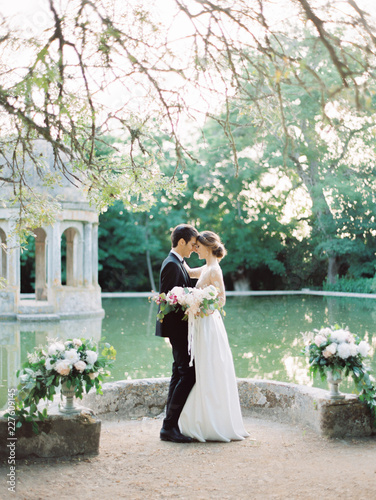 Groom and bride kissing on a ceremony