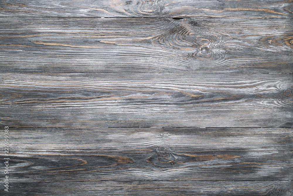 Obraz premium Texture of old wooden planks table. Gray wood scuffed background.