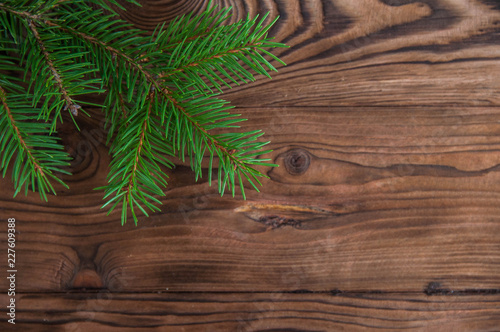 Happy new year and Merry Christmas concept. Christmas tree with new year decoration and bokeh on the wooden background.