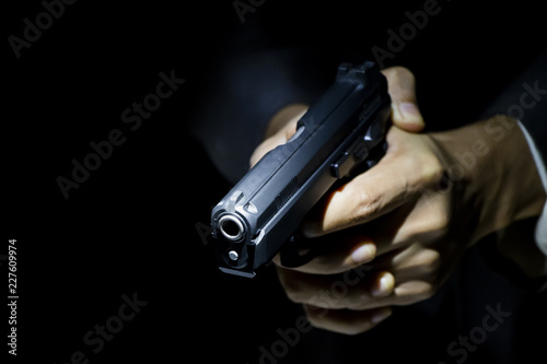 close up gunman on dark background