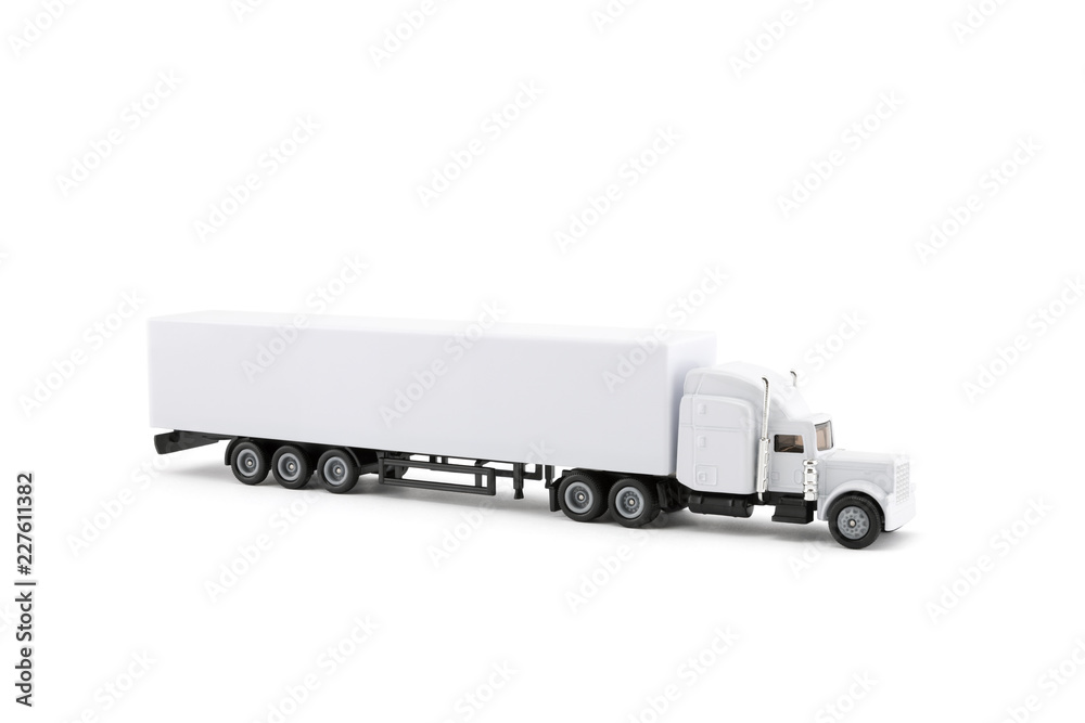 White long truck miniature with a trailer on white background. Clipping path included. White long truck miniature with a trailer on white background. Clipping path included.