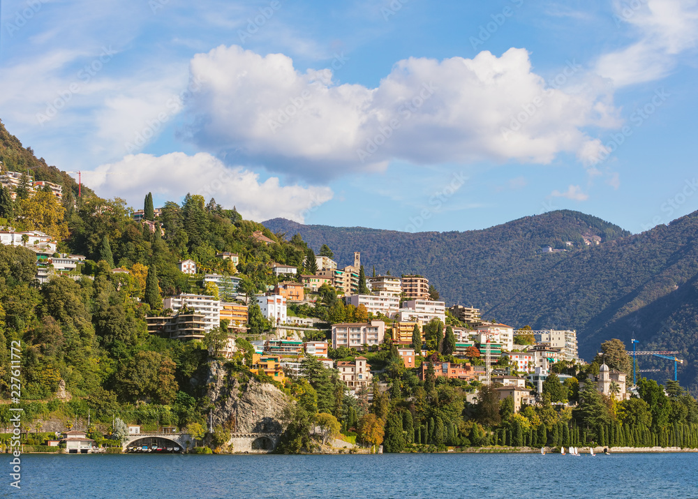 Lake Lugano and buildings on the foot of the Monte Bre mountain in Switzerland