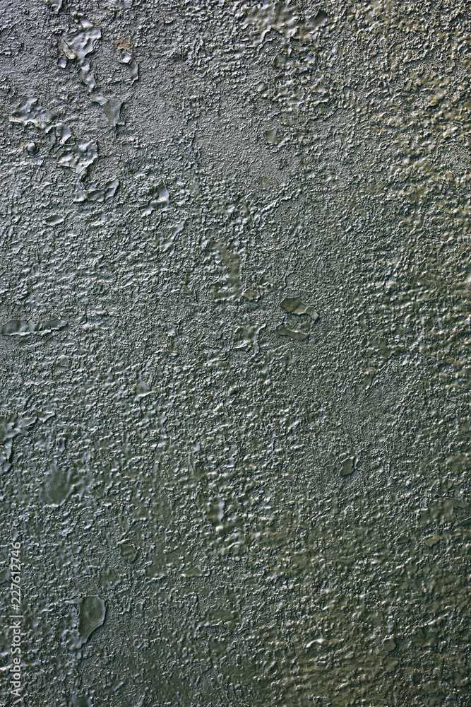 Old green peeling paint on the armored fighting vehicle. Rusty dye background texture. Old green peeling paint on the armored fighting vehicle. Rusty dye background texture.