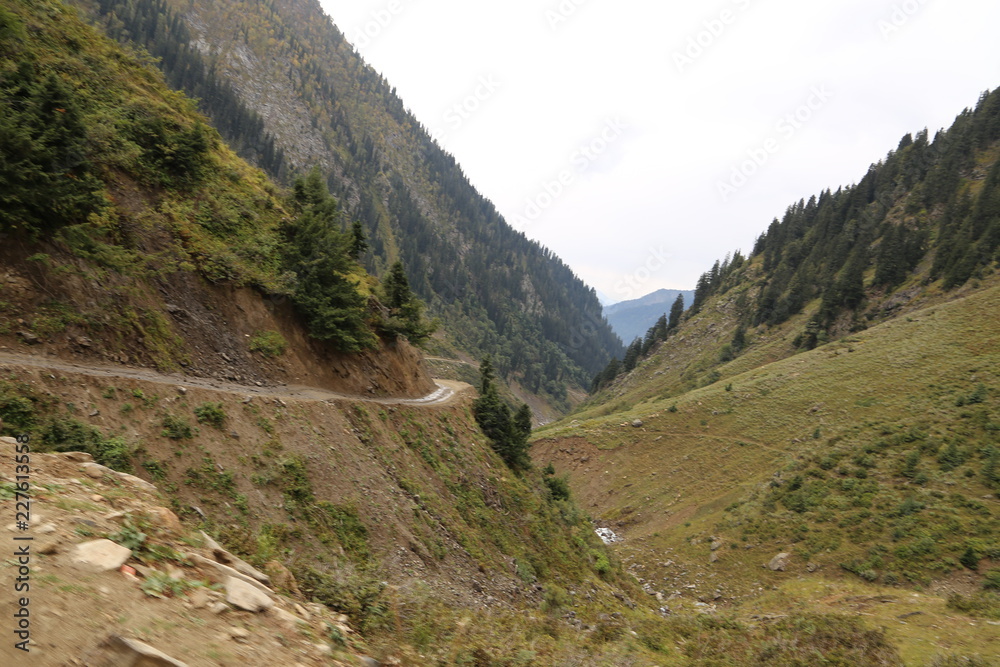 River and track passing through under mountains River and track passing through under mountains
