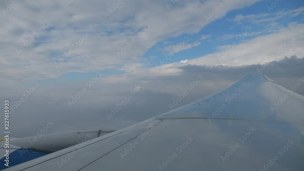 Clouds,view from airplane window,wing aircraft in the sky Clouds,view from airplane window,wing aircraft in the sky