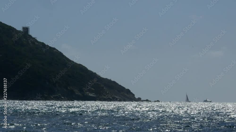 Sailboat far away on the horizon Sailboat far away on the horizon