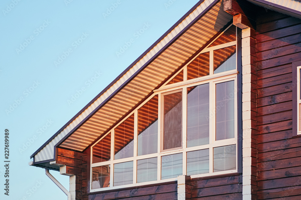 Part of facade of modern house with glazed veranda