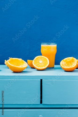 Orange juice on blue background