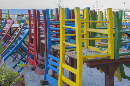 Colourful chairs in an outdoor restaurant