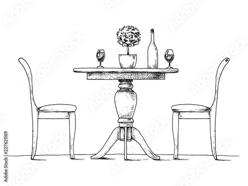 Part of the dining room. Round table and chairs.On the table vas