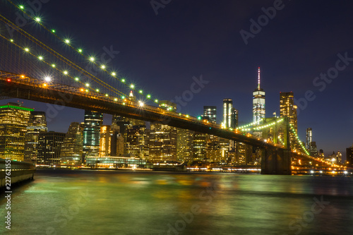Brooklyn Bridge at night with water reflection, New York City Skyline, NY, USA © great_photos