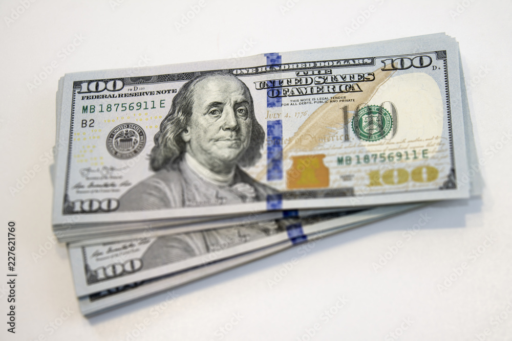 Stack of one hundred dollar banknotes close up view Stack of one hundred dollar banknotes close up view