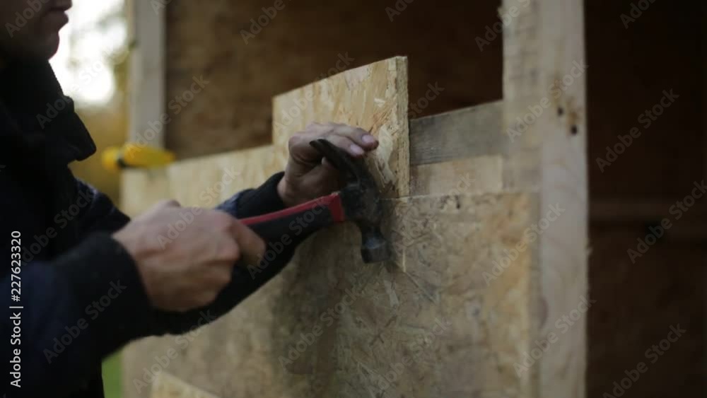 Young guy running with a hammer Young guy running with a hammer