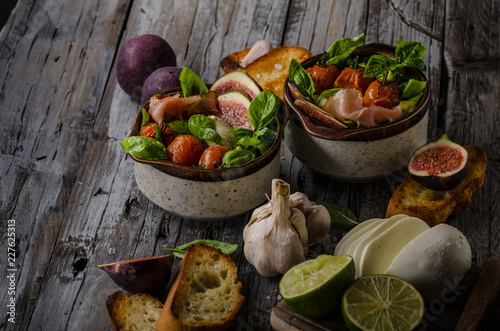 Fototapeta Naklejka Na Ścianę i Meble -  Homemade fresh figs salad with herbs and roasted garlic toast