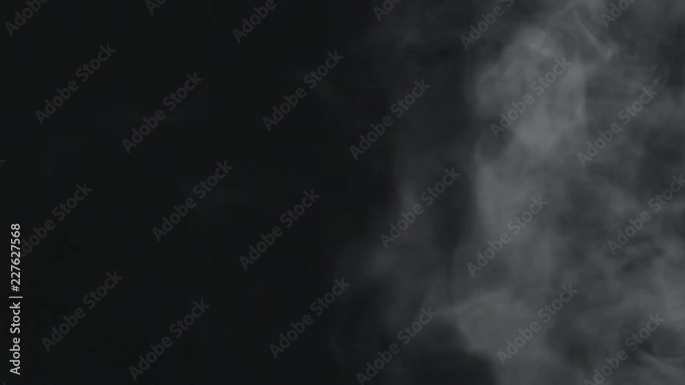 slow motion vapor steam from right side over black background slow motion vapor steam from right side over black background
