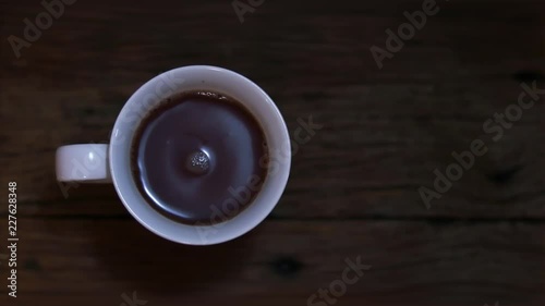 Coffee on wood background top view.