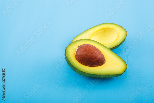 Avocado on old wooden table.